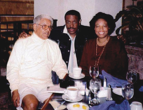 At the Rollins Colloquium, 1996: from left, Charlemae Hill Rollins's son, Joseph Rollins Jr.; author Christopher Paul Curtis; and Dr. Bracy. Photo courtesy of Pauletta Brown Bracy.